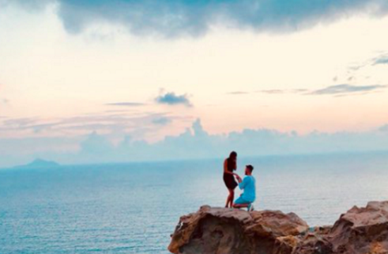 Teenager looks for couple after capturing their proposal on camera in Santorini