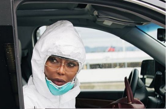 Naomi Campbell wears full-body white protective suit at airport