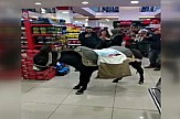 Turks go shopping with donkey to protest plastic-bag charge in market