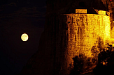 Full moon shining bright over Koroni castle in southern Greece